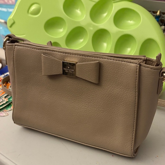 kate spade Handbags - Kate Spade Taupe Crossbody Bag with Bow